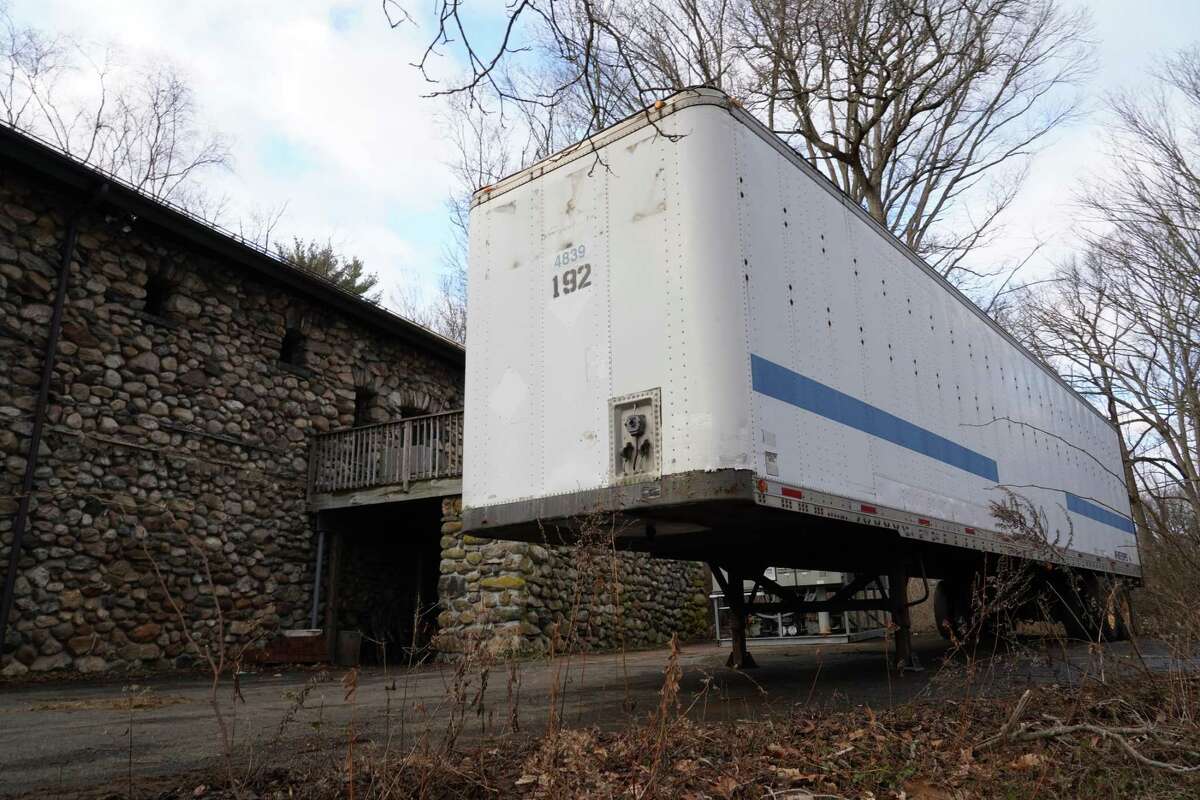 Equipment for a skating rink has been delivered in New Canaan and is being stored in this trailer behind the Carriage Barn.