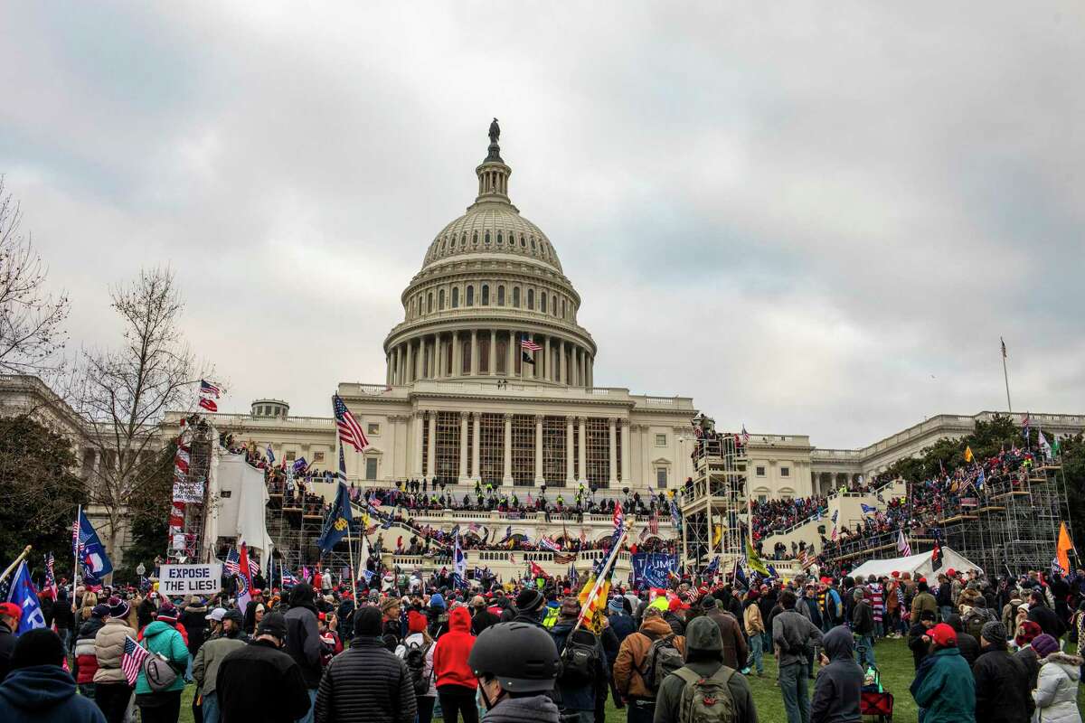 Protesters outside the Capitol in Washington on Wednesday, Jan 6, 2020, after protesters breached security and entered the building. The scaffolding and and risers are all temporarily in place as part of the inauguration ceremony. (Jason Andrew/The New York Times)