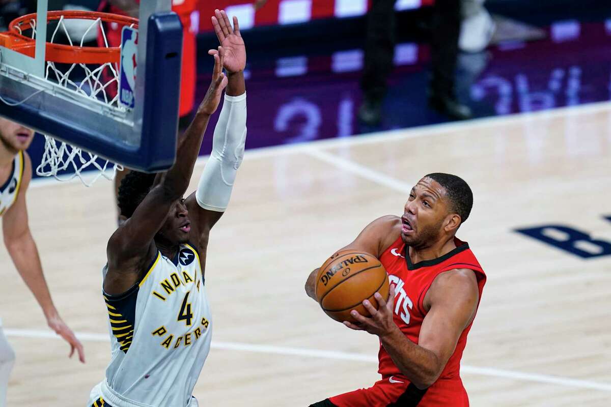 Houston Rockets guard Eric Gordon (10) shoots over Indiana Pacers guard Victor Oladipo (4) during the third quarter of an NBA basketball game in Indianapolis, Wednesday, Jan. 6, 2021. (AP Photo/Michael Conroy)