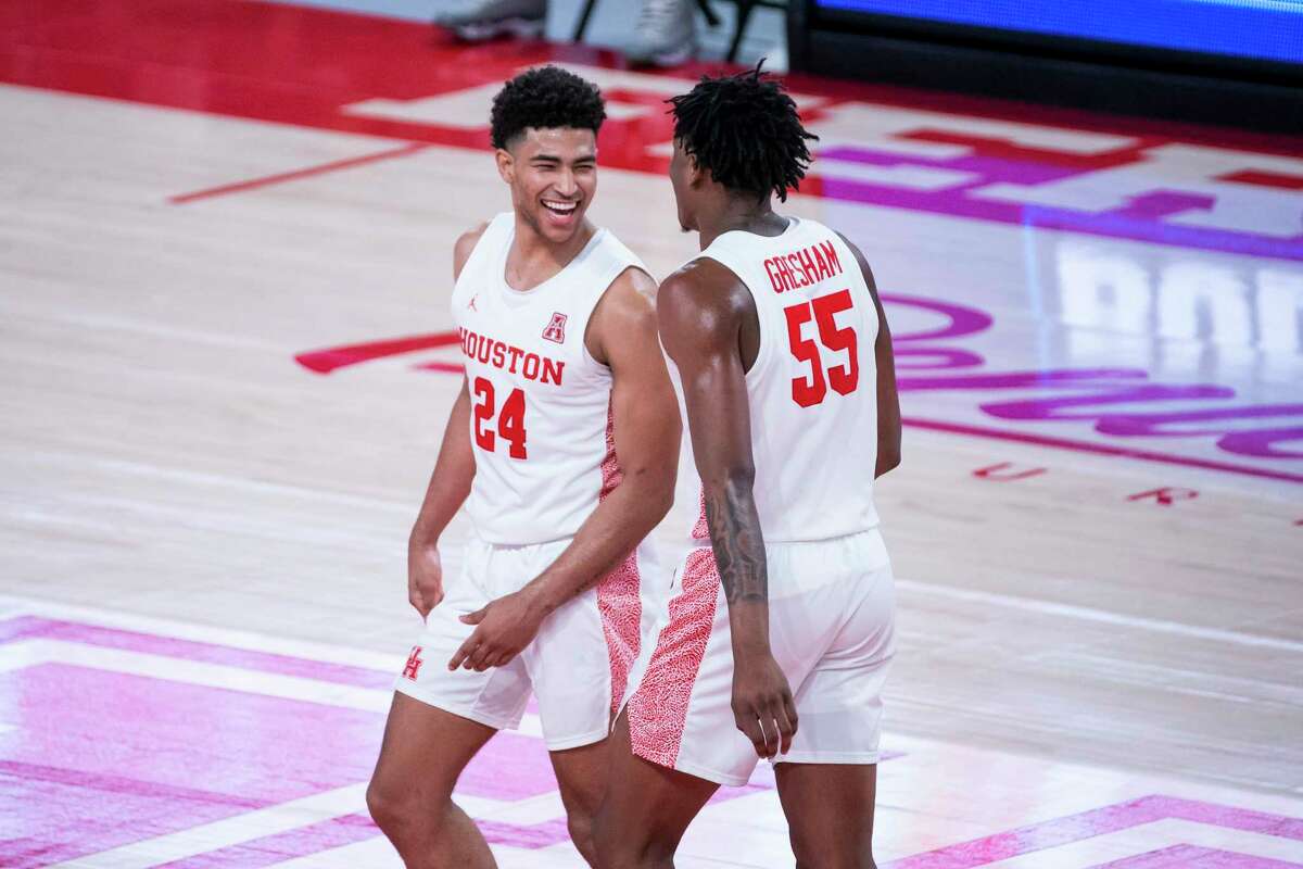 Houston Cougars guard Quentin Grimes (24) and forward Brison Gresham (55) celebrate a defensive stop during the second half of the University of Houston Cougars' 70-63 win over the Wichita State Shockers on Wednesday, Jan. 6, 2021, at the Feritta Center in Houston.