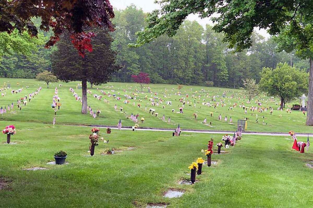 Flags mark the grave markers of veterans at Gate of Heaven Cemetery on May 22, 2018.
