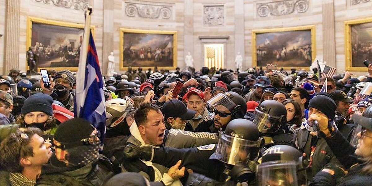 Police intervene in US President Donald Trumps supporters who breached security and entered the Capitol building in Washington D.C., United States on January 06, 2021. Pro-Trump rioters stormed the US Capitol as lawmakers were set to sign off Wednesday on President-elect Joe Biden's electoral victory in what was supposed to be a routine process headed to Inauguration Day.