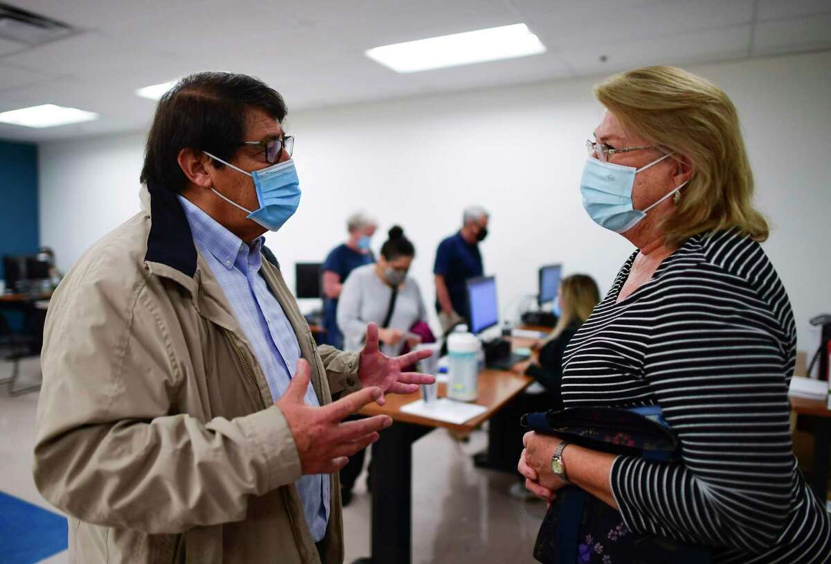 Catherine Anton, right, thanks George B. Hernández, Jr., president and CEO of University Health, for the COVID-19 vaccination service provided by University Health at Wonderland of the Americas mall on Jan. 6.