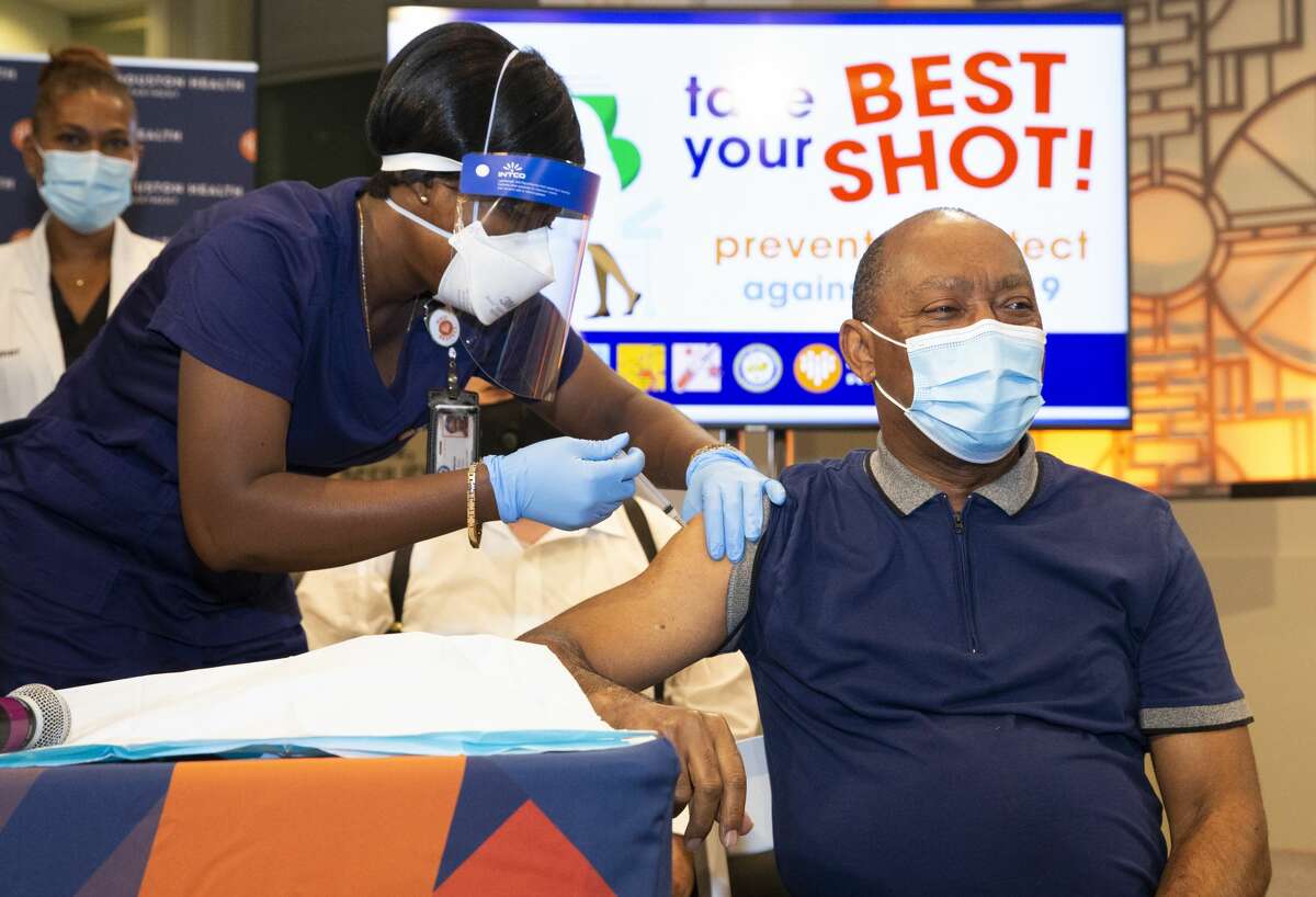 Houston Mayor Sylvester Turner gets his first dose of Moderna COVID-19 vaccine Monday, Jan. 4, 2021, at City Hall in Houston.