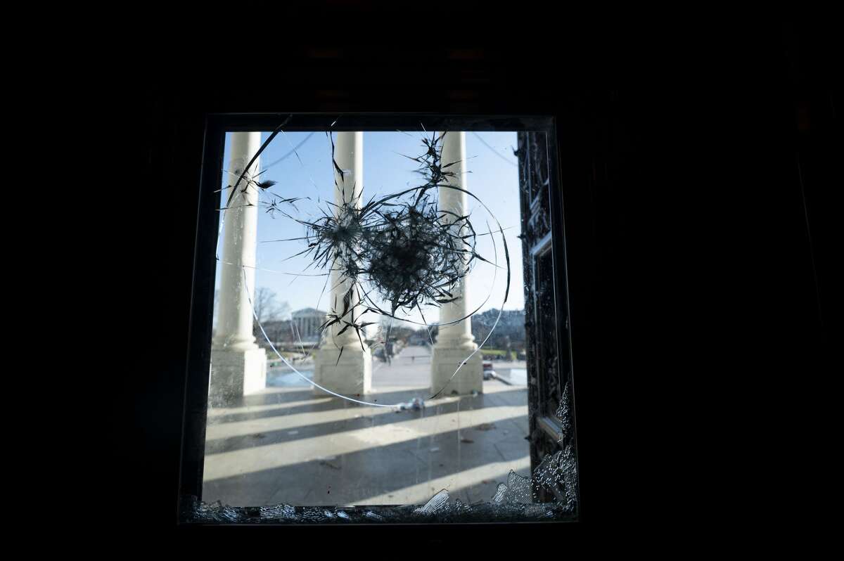 The East Front of the U.S. Capitol is seen through a shattered door leading to the center steps on Thursday morning, January 7, 2021, following the riot at the Capitol the day before. (Photo By Bill Clark/CQ-Roll Call, Inc via Getty Images)