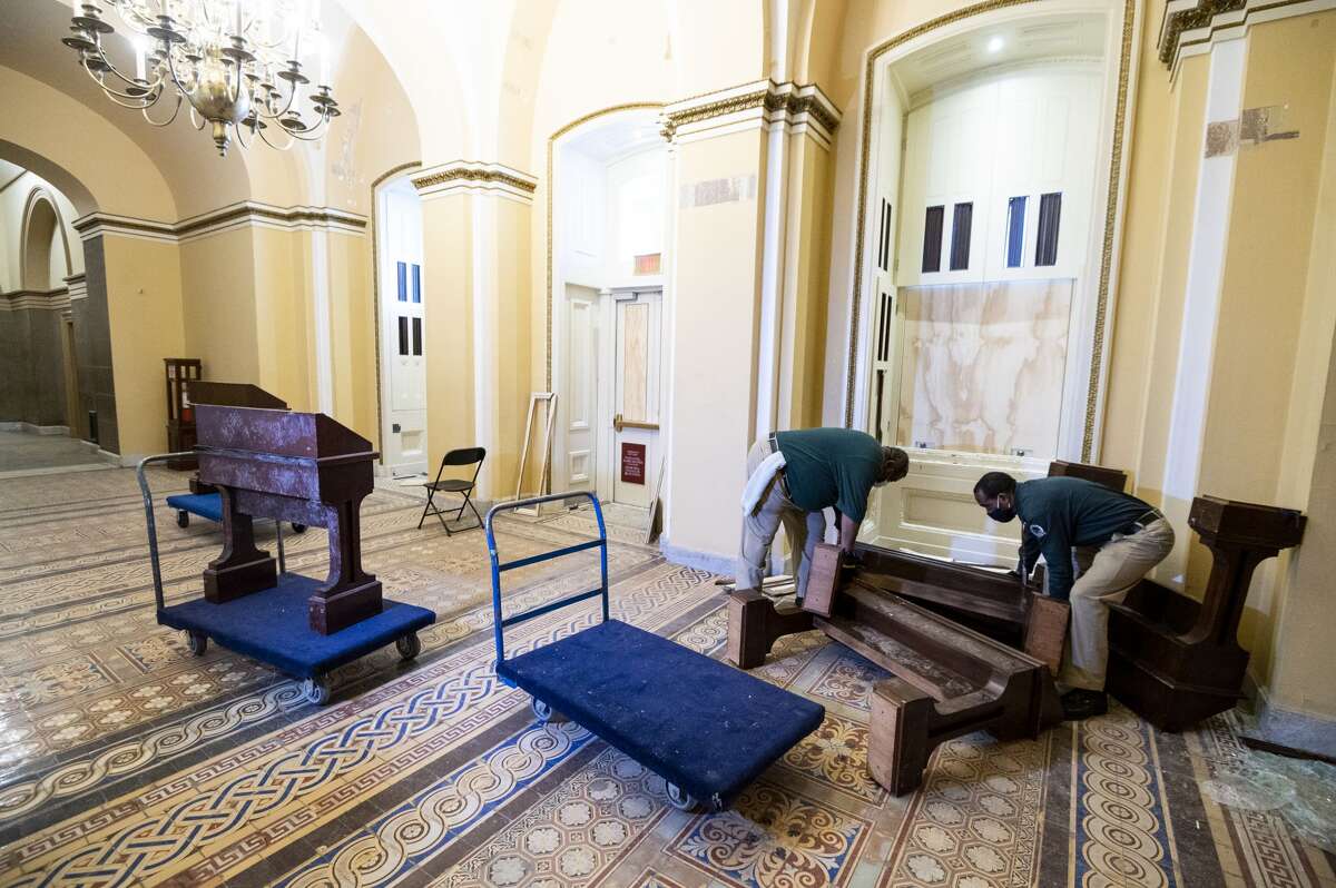 Capitol workers remove damaged furniture on the first floor of the Senate side of the U.S. Capitol on Thursday morning, January 7, 2021, following the riot at the Capitol the day before. (Photo By Bill Clark/CQ-Roll Call, Inc via Getty Images)