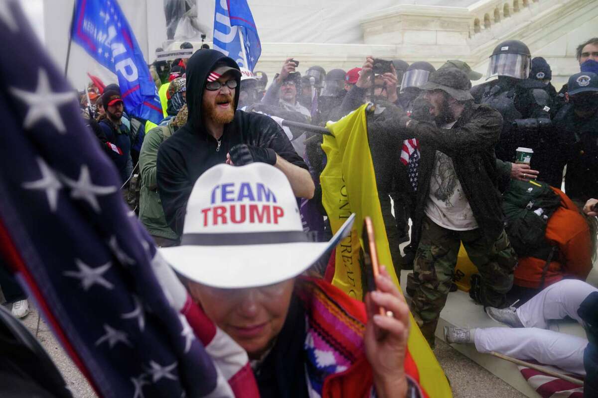 Trump supporters try to break through a police barrier on Wednesday, Jan. 6, 2021, at the Capitol in Washington, D.C.