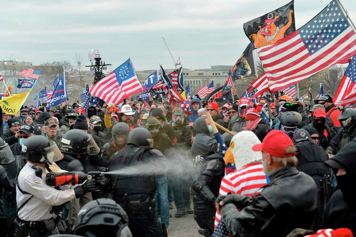 Trump supporters clash with police and security forces as people move to storm the U.S. Capitol Building in Washington, D.C, on Jan. 6, 2021.