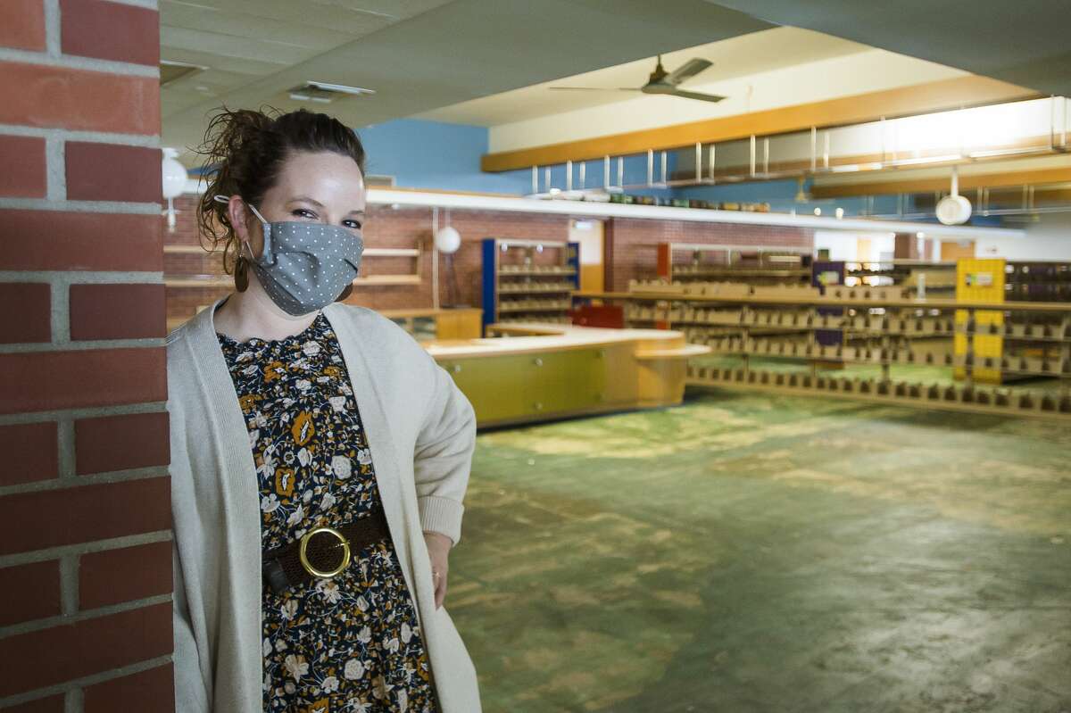 Grace A. Dow Memorial Library Director Miriam Andrus poses for a portrait inside the children's section of the library Wednesday, Jan. 6, 2021. The library is still undergoing renovations after sustaining severe damage during the mid-Michigan dam failures and flood in May. (Katy Kildee/kkildee@mdn.net)