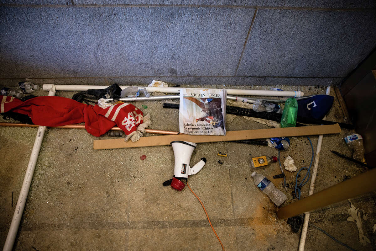 Damage and debris are seen left behind by a pro-Trump mob in the entrance to the western promenade of the U.S. Capitol building on January 7, 2021 in Washington, DC. Following a rally yesterday with President Donald Trump on the National Mall, a pro-Trump mob stormed and broke into the U.S. Capitol building causing a Joint Session of Congress to delay the certification of President-elect Joe Biden's victory over President Trump.