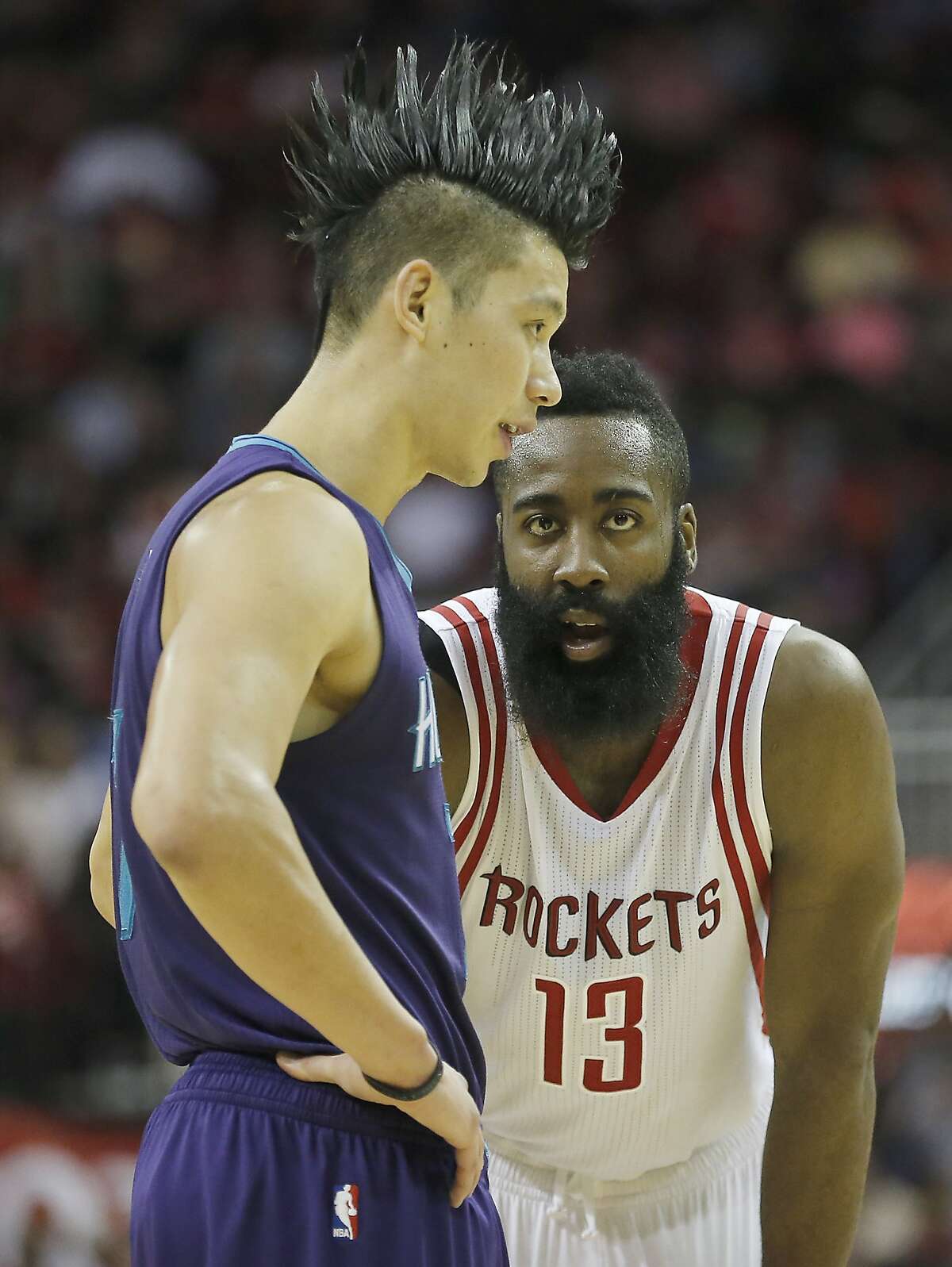 Houston Rockets guard James Harden (13) eyes Charlotte Hornets guard Jeremy Lin (7) in second half on December 21, 2015 at the Toyota Center in Houston. Rockets won 102 to 95.