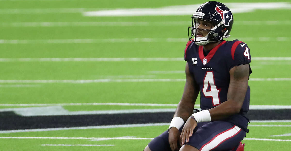 Houston Texans quarterback Deshaun Watson kneels on the field after failing convert on third down near the end of the game against the Tennessee Titans during the fourth quarter of an NFL football game at NRG Stadium on Sunday, Jan. 3, 2021, in Houston.