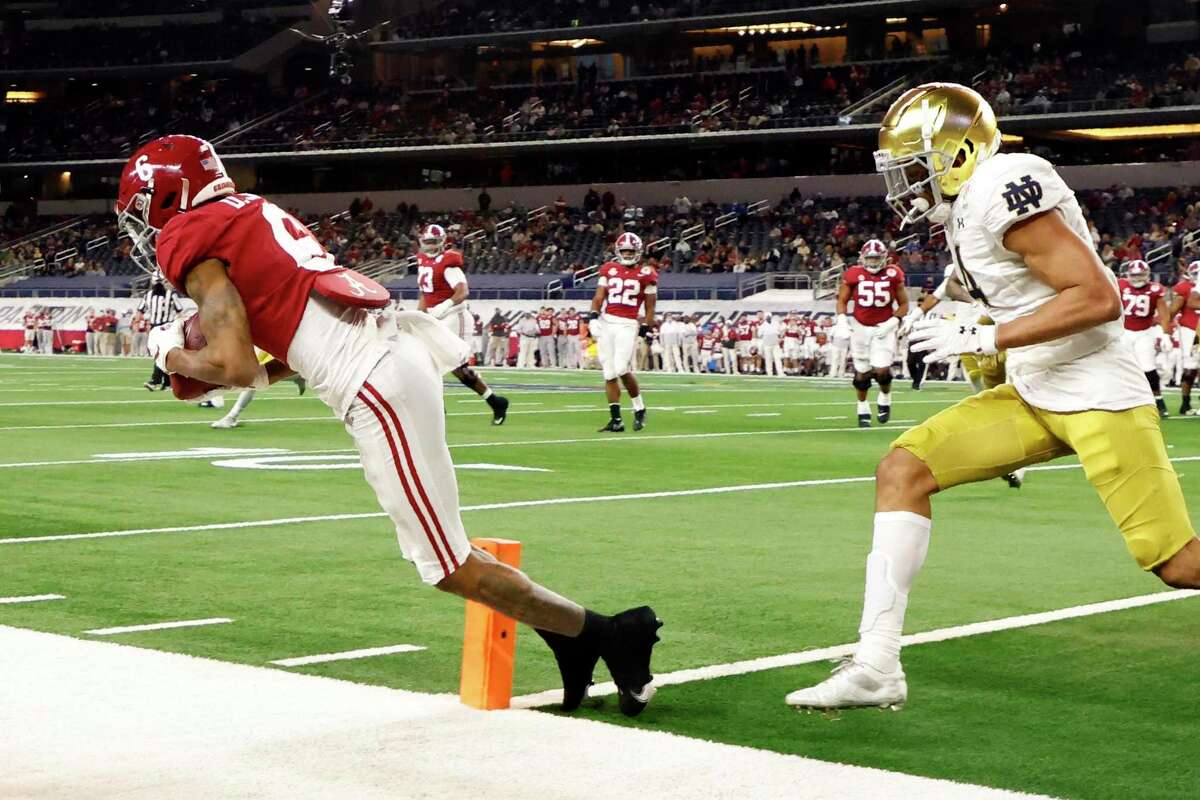 Alabama wide receiver DeVonta Smith (6) catches a touchdown pass while defended by Notre Dame's Nick McCloud in the second half of the Rose Bowl in Arlington, Texaslast week. Smith was named the Walter Camp Player of the Year on Thursday.
