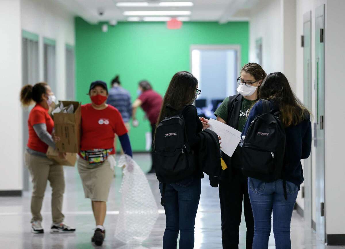 Students make their way to classes at Houston ISD’s Austin High School.