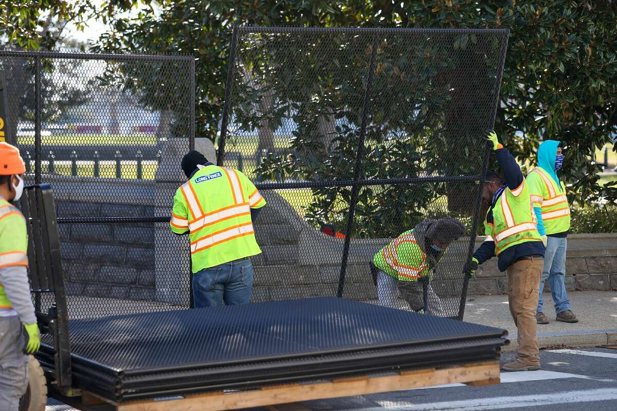 Workers install fences in front of The U.S Capitol building after massive protest as Trump supporters entered the building in Washington D.C., United States on January 07, 2020. (Photo by Tayfun Coskun/Anadolu Agency via Getty Images)