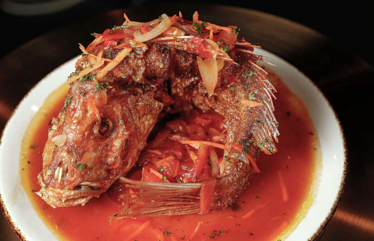 Deep-fried red snapper with brown stew broth at James Harden's new restaurant Thirteen,Wednesday, Jan. 6, 2021, in Houston .