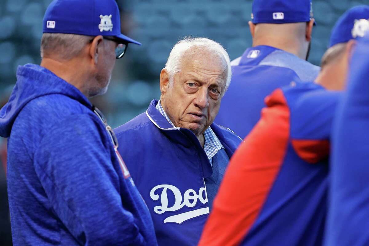 FILE - JANUARY 8, 2021: It was reported that Tommy Lasorda, the former manager of the Los Angeles Dodgers has died at the age of 93 January 8, 2021. CHICAGO, IL - OCTOBER 17: Former Los Angeles Dodgers manager Tommy Lasorda (C) and manager Joe Maddon of the Chicago Cubs meet before game three of the National League Championship Series at Wrigley Field on October 17, 2017 in Chicago, Illinois.