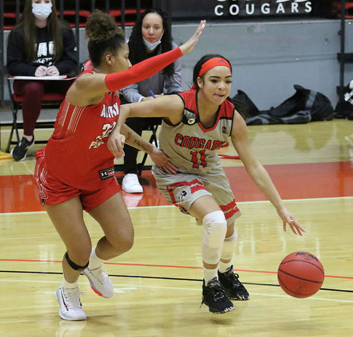 SIUE’s Mikia Keith (right) handles the ball against pressure from Austin Peay’s Brianah Ferby on Thursday afternoon at First Community Arena in Edwardsville.