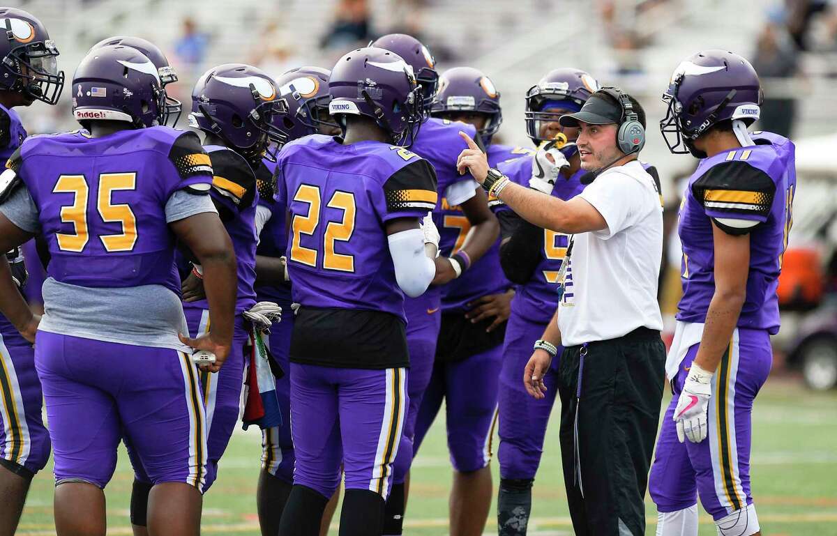 In his first year as Head coach, Westhill's Joe DeVellis talks with his players in a FCIAC football game against Norwalk on Saturday, Sept. 15, 2018 in Stamford, Connecticut. Norwalk defeated Westhill 48-21 in the Vikings home opener at J.Walter Kennedy Stadium.