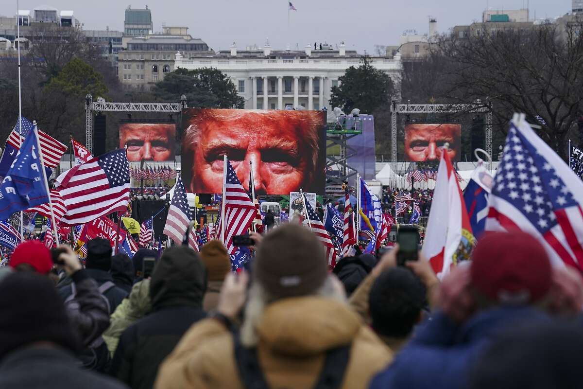 Trump supporters participate in a rally Wednesday, Jan. 6, 2021 in Washington. As Congress prepares to affirm President-elect Joe Biden's victory, thousands of people have gathered to show their support for President Donald Trump and his baseless claims of election fraud. The president is expected to address a rally on the Ellipse, just south of the White House. (AP Photo/John Minchillo)