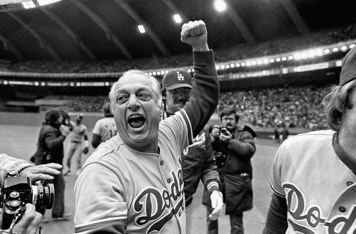 FILE - Los Angeles Dodgers manager Tom Lasorda celebrates after the Dodgers beat the Montreal Expos for the National League title in Montreal, in this Monday, Oct. 19, 1981, file photo. Tommy Lasorda, the fiery Hall of Fame manager who guided the Los Angeles Dodgers to two World Series titles and later became an ambassador for the sport he loved during his 71 years with the franchise, has died. He was 93. The Dodgers said Friday, Jan. 8, 2021, that he had a heart attack at his home in Fullerton, California. (AP Photo/Grimshaw, File)