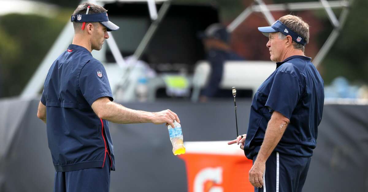 New England Patriots head coach Bill Belichick, right, chats with Director of Player Personnel Nick Caserio during New England Patriots practice at Gillette Stadium in Foxborough, MA on Aug. 27, 2019. (Photo by Jim Davis/The Boston Globe via Getty Images)