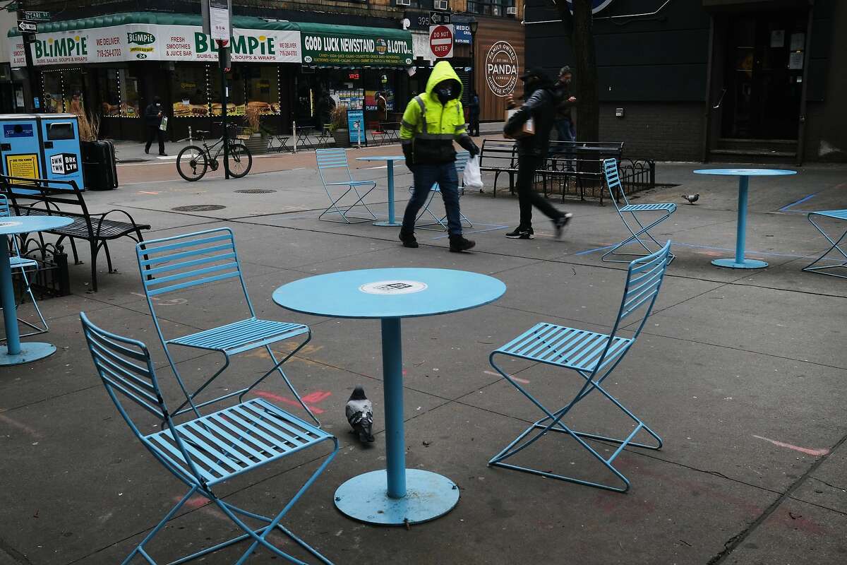 Empty tables sit outside of restaurants in downtown Brooklyn on January 08, 2021 in New York City.  In Connecticut, unprecedented numbers of New York residents have been moving into the Nutmeg State. As of July, approximately 10,000 people had requested to change their address from New York to Connecticut. There were only 1,200 requests in 2019 during the same period.  That number could be higher as the USPS has not reported new data on address changes into the state since last July.