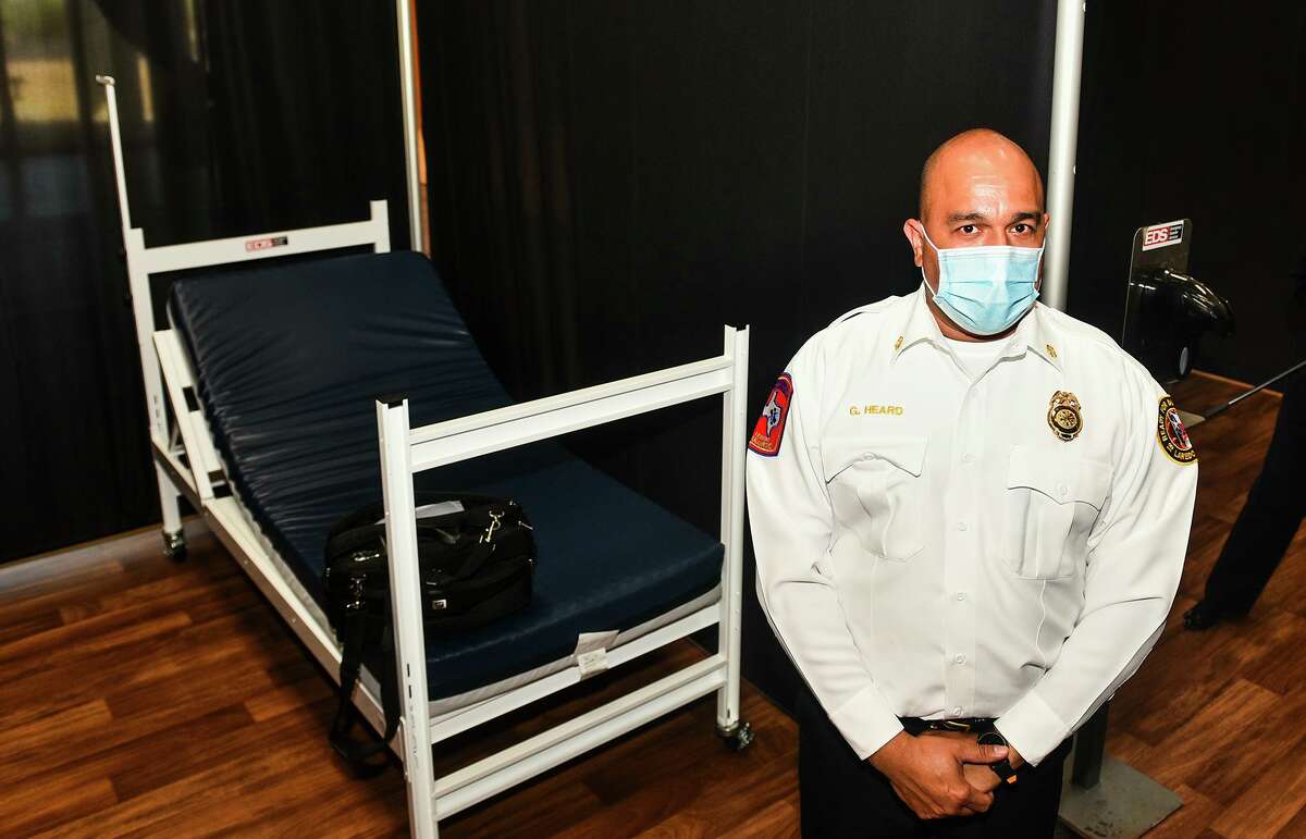 Laredo Fire Chief Guillermo Heard stands next to one of the beds at the infusion center for mild COVID-19 cases, Friday, Jan. 8, 2021, at the Haynes Recreation Center during a media walk-through.