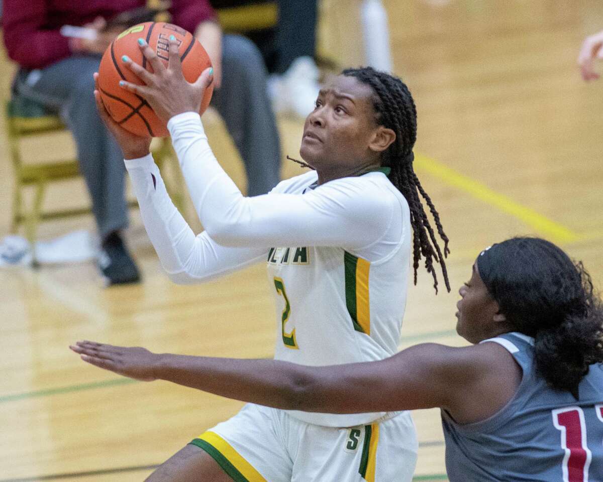 Siena College junior Amari Anthony drives to the basket in front Rider University senior Daija Moses during a Metro Atlantic Athletic Conference game at the Alumni Recreation Center on the Siena campus in Loudonville, NY, on Saturday, Jan. 9, 2020 (Jim Franco/special to the Times Union.)