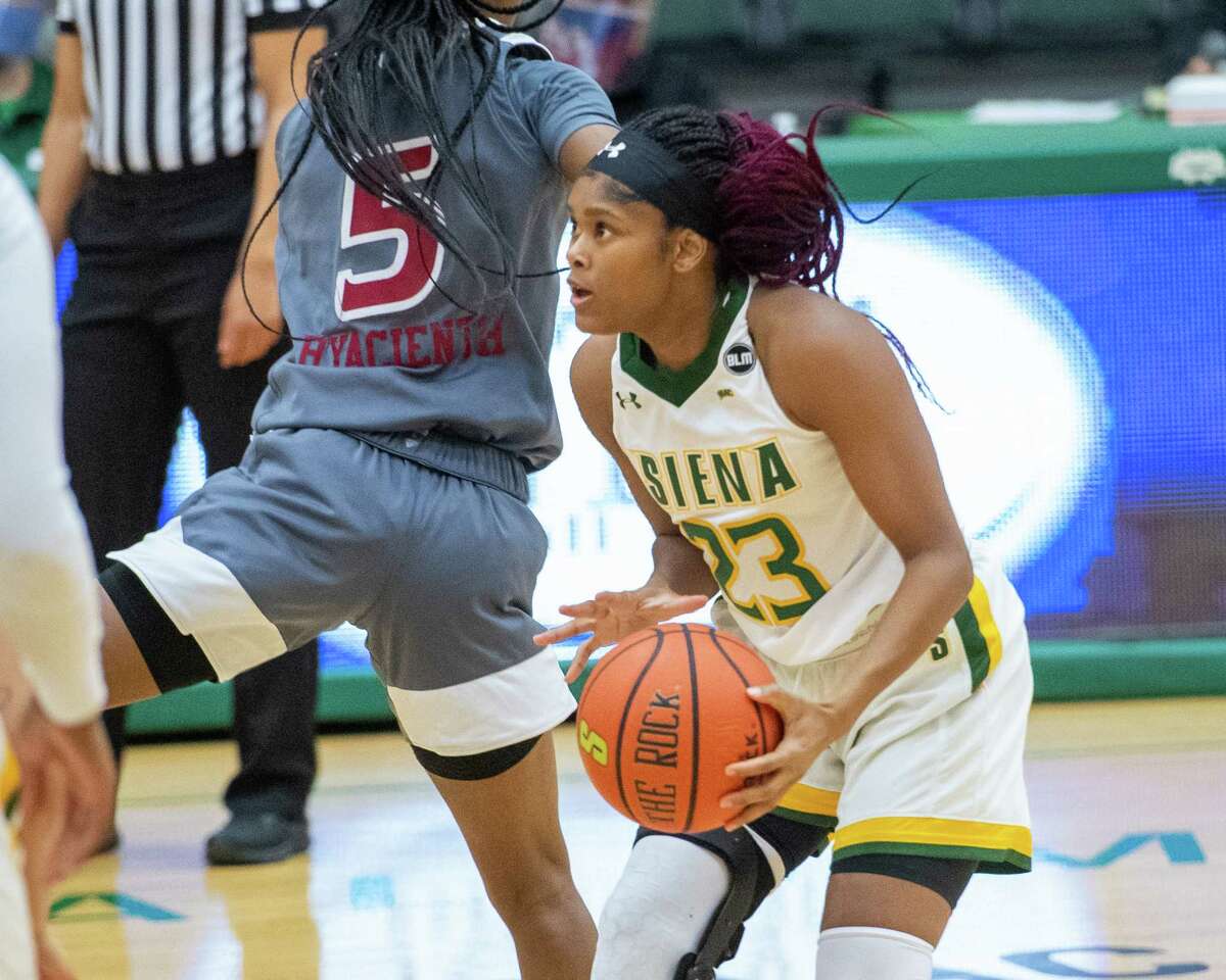 Siena College graduate student Isis Young takes a jumper after putting on a head fake in front of Rider University sophomore Maya Hyacienth during a Metro Atlantic Athletic Conference game against Rider University at the Alumni Recreation Center on the Siena campus in Loudonville, NY, on Saturday, Jan. 9, 2020 (Jim Franco/special to the Times Union.)