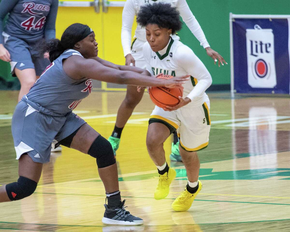 Siena College senior Rayshel Brown battles for the ball with Rider University senior Daija Moses during a Metro Atlantic Athletic Conference game at the Alumni Recreation Center on the Siena campus in Loudonville, NY, on Saturday, Jan. 9, 2020 (Jim Franco/special to the Times Union.)