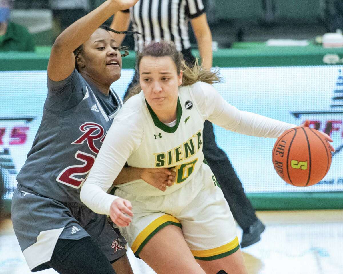 Siena College junior Margo Peterson drives to the basket in front of Rider University junior Lenaejha Evans during a Metro Atlantic Athletic Conference game at the Alumni Recreation Center on the Siena campus in Loudonville, NY, on Saturday, Jan. 9, 2020 (Jim Franco/special to the Times Union.)
