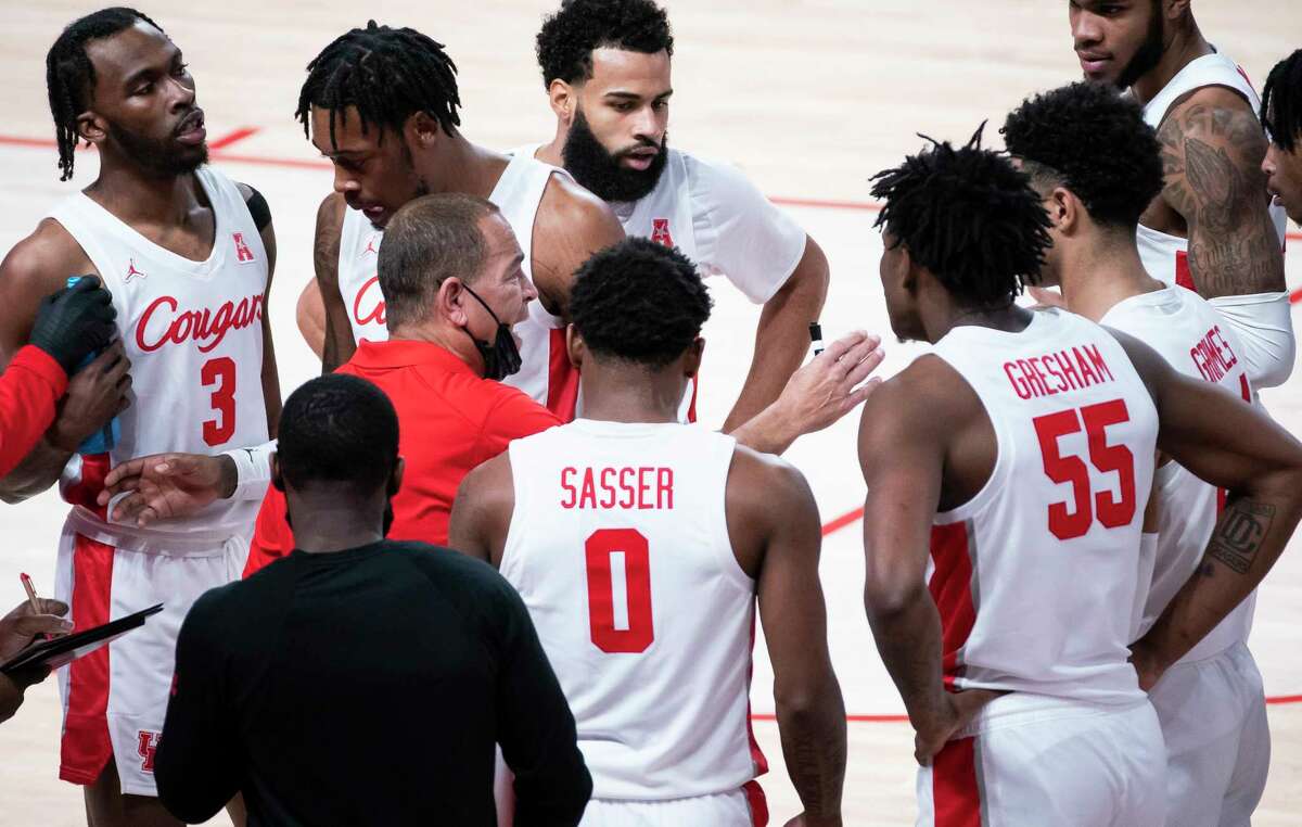 Cougars head coach Kelvin Sampson talks with his team during a timeout during the first half of a game between the University of Houston Cougars and the Tulane University Green Wave on Saturday, Jan. 9, 2021, at the Fertitta Center in Houston.