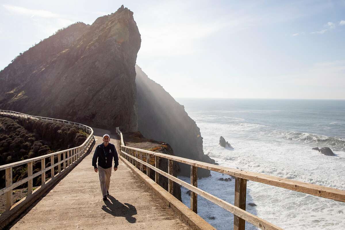 Dr. Padraig Duignan poses for a portrait while walking along a popular whale sighting location near Point Bonitas Lighthouse in Mill Valley, Calif. Thursday, January 7, 2021.