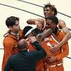 Texas players celebrate after defeating West Virginia on a last-second shot by Andrew Jones.