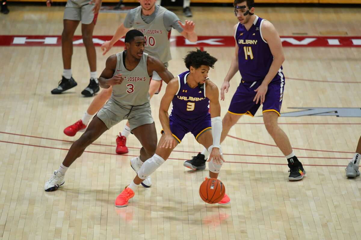 UAlbany guard JoJo Anderson looks for room against St. Joseph's defense Saturday in a 67-64 loss.