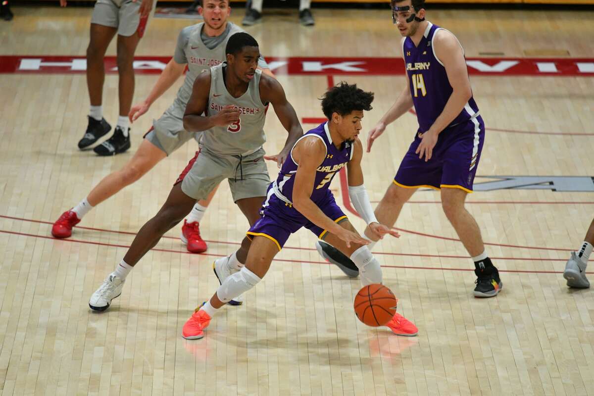 UAlbany guard JoJo Anderson looks for room against St. Joseph's defense Saturday in a 67-64 loss.