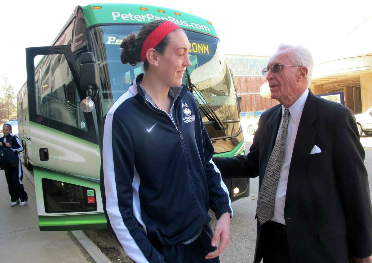 Former Connecticut men's basketball coach Dee Rowe, right, wishes forward Breanna Stewart luck Thursday, April 3, 2012 in Storrs, Conn., as she prepares to board the team bus to the airport for a flight to the Women's NCAA Final Four in Nashville. (AP Photo/Pat Eaton-Robb)