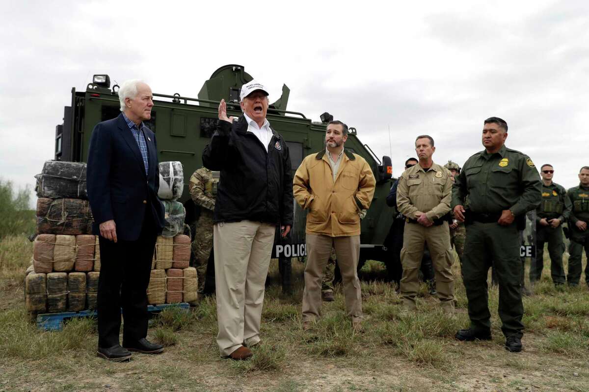 President Donald Trump speaks as tours the U.S. border with Mexico at the Rio Grande on the southern border, Thursday, Jan. 10, 2019, in McAllen, Texas, as Sen. John Cornyn, R-Texas, left, and Sen. Ted Cruz, R-Texas, listen. (AP Photo/ Evan Vucci)