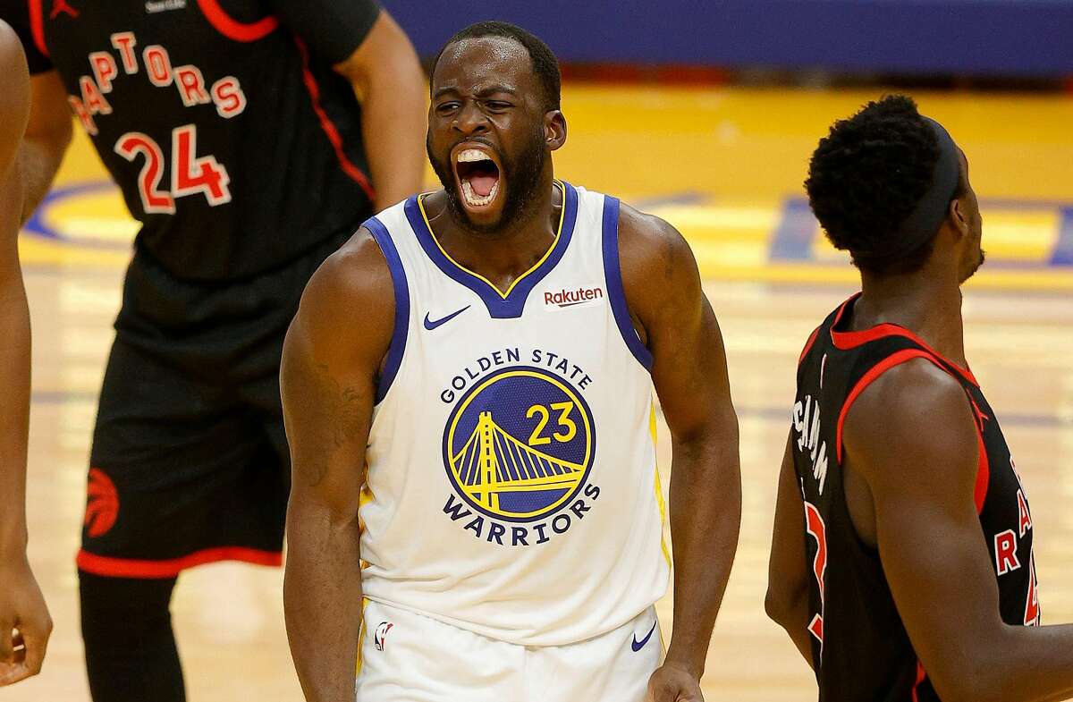 FILE: Draymond Green #23 of the Golden State Warriors reacts after he made a basket and was fouled during their game against the Toronto Raptors at Chase Center on January 10, 2021 in San Francisco.
