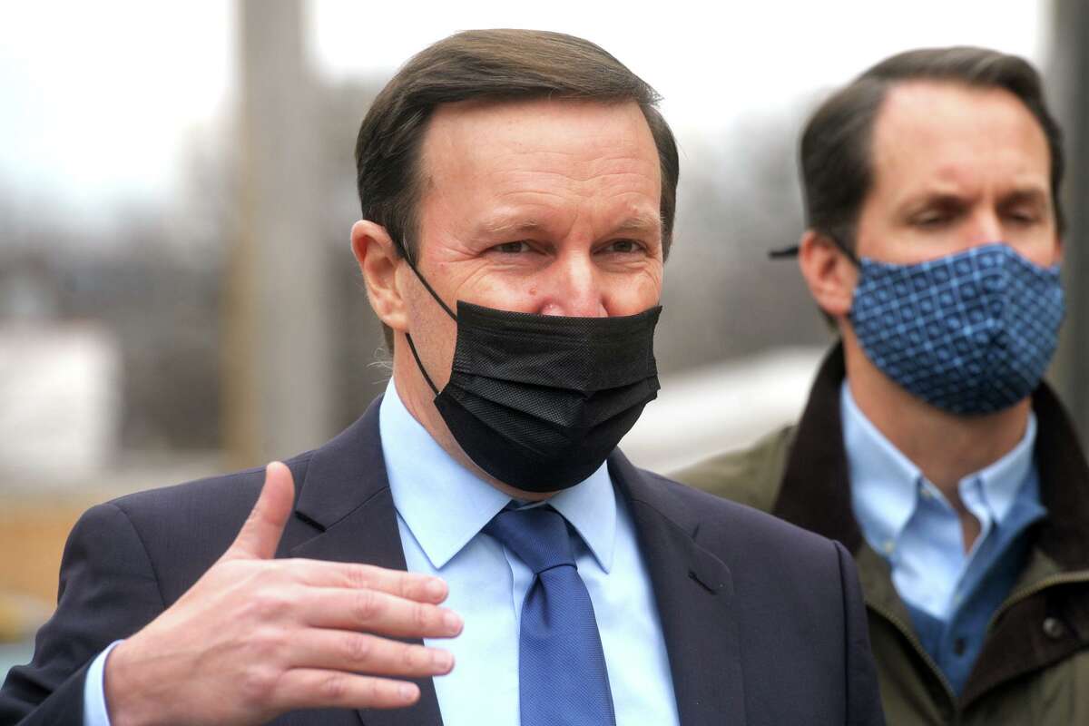 U.S. Sen. Chris Murphy speaks during a tour of the Thomas Merton Center, in Bridgeport on Monday. Murphy is seen here with U.S. Rep. Jim Himes.