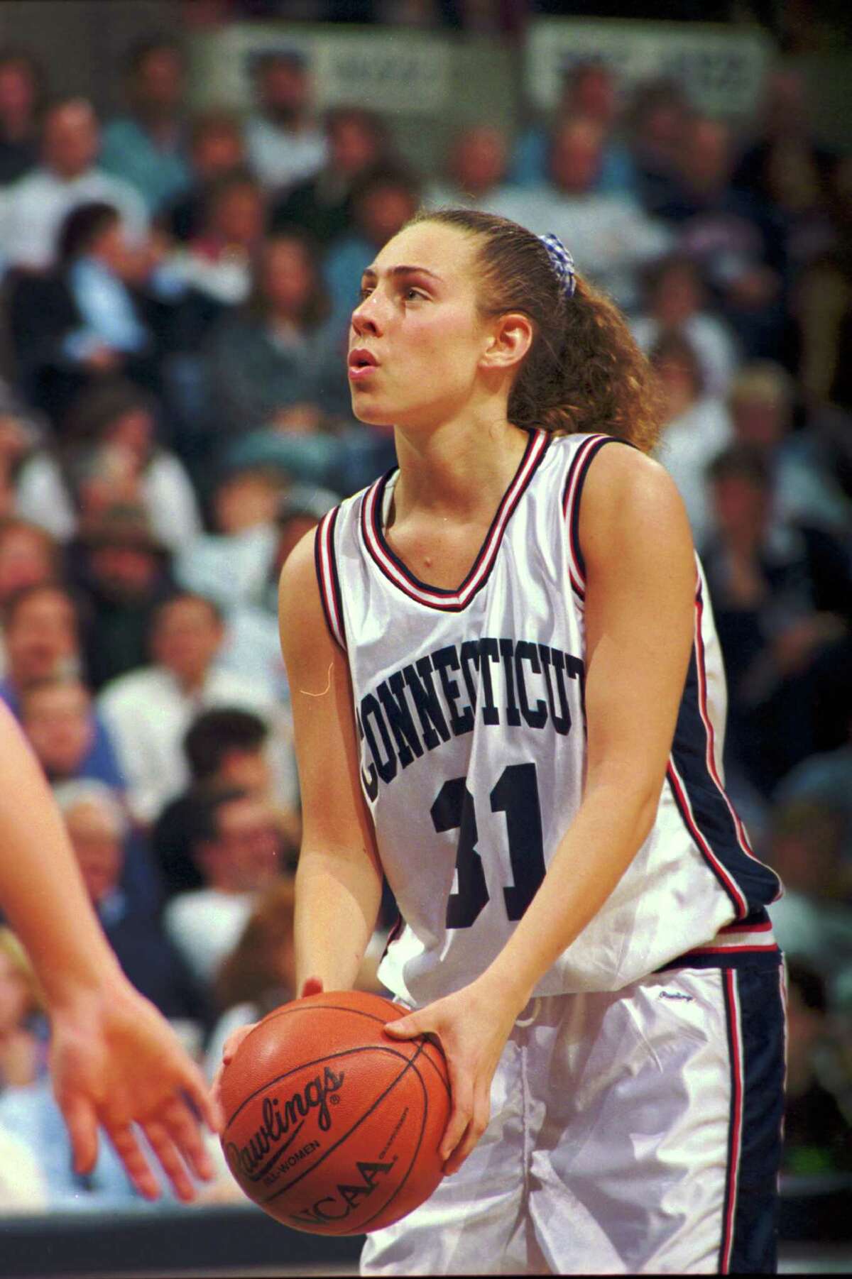 Carla Berube, forward for the University of Connecticut women's basketball team, shoots a foul shot during a game at Storrs, CT, 1997. (Photo by Bob Stowell/Getty Images)