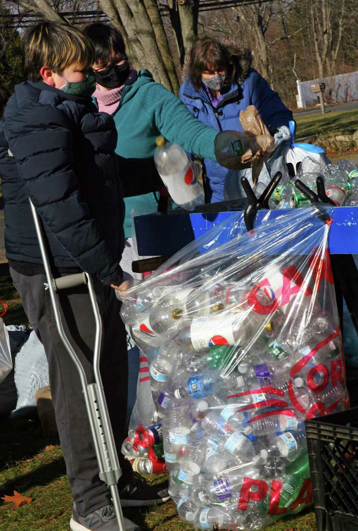 Boy Scout Troop 25 holds its monthly redeemable bottle and can drive at First United Methodist Church in Shelton, Conn., on Saturday Jan. 9, 2021. The event, which helps raise money for scouting activities, is held each first Saturday of each month from 10 a.m. to 1 p.m.