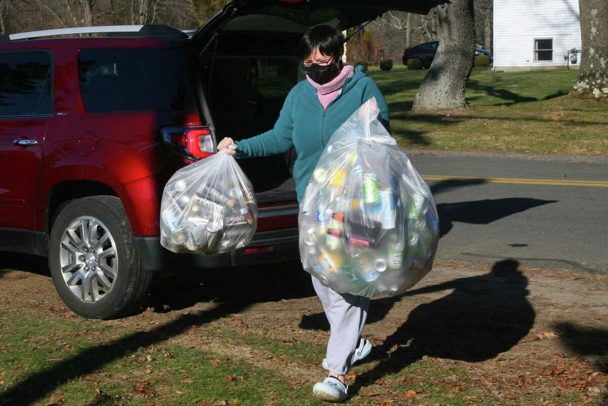 Boy Scout Troop 25 holds its monthly redeemable bottle and can drive at First United Methodist Church in Shelton, Conn., on Saturday Jan. 9, 2021. The event, which helps raise money for scouting activities, is held each first Saturday of each month from 10 a.m. to 1 p.m.