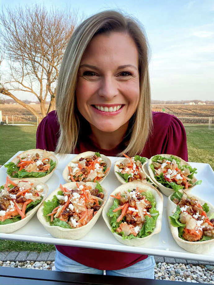 Rachel serving her Buffalo Chicken Tacos, adopted after a Buffalo Chicken Salad dish at Jack’s Urban Eats based in California. The dish features a mixture of walnuts and apples with a kick of buffalo sauce.