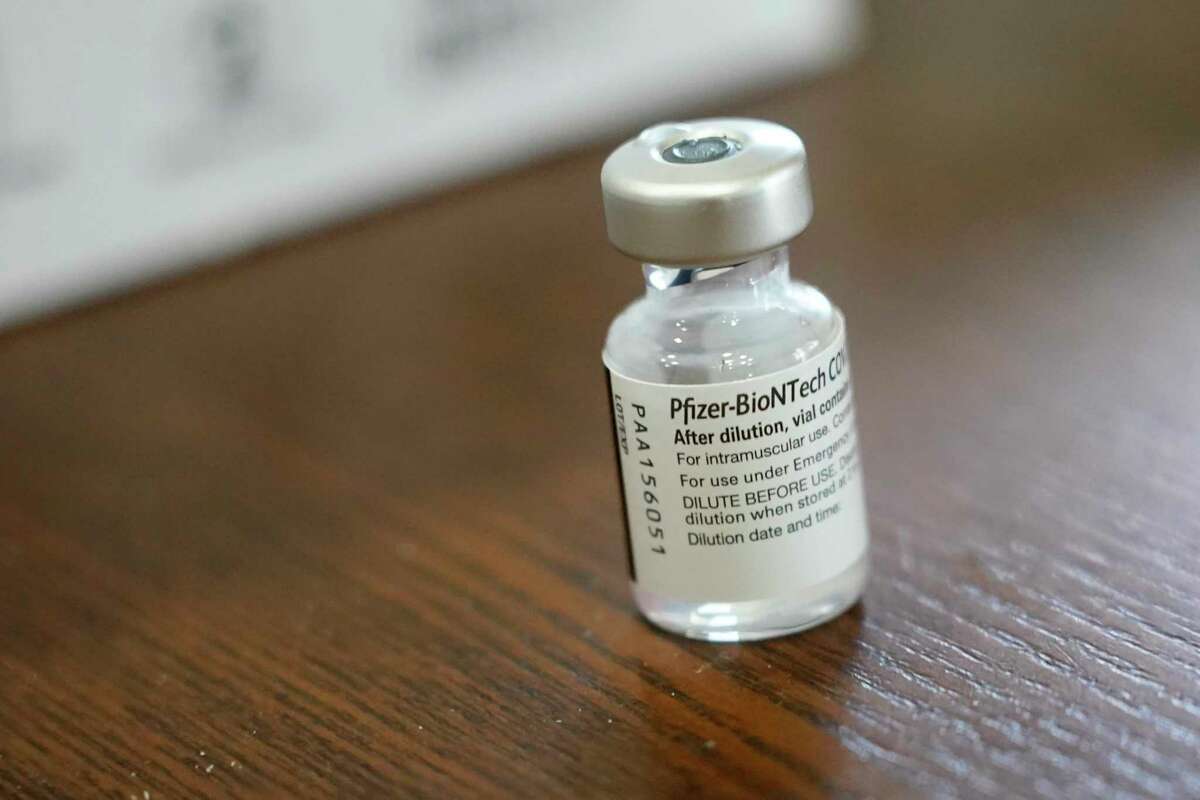 A vial of the Pfizer-BioNTech COVID-19 vaccine awaits further use. (AP Photo/Rogelio V. Solis)