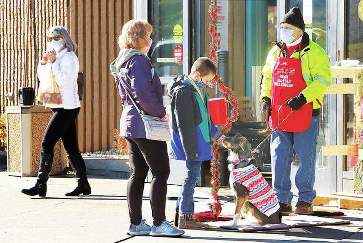 Molly, the rescue dog of Salvation Army bell ringer Mike Cleary, attracted attention atr the collection station outside the Godfrey Schnuck’s grocery store this year. Officials said this year’s campaign surpassed its goal and received a gold coin in a red kettle in Wood River.
