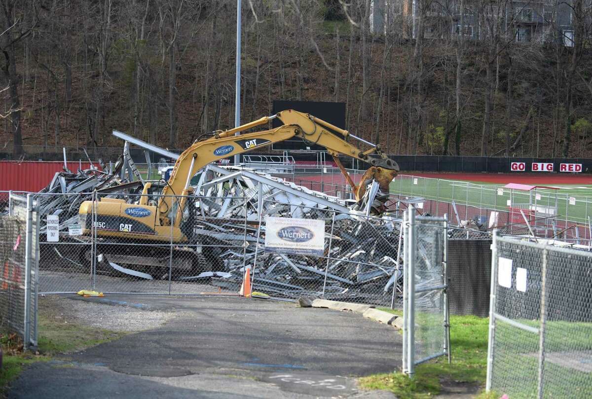 The Cardinal Stadium bleachers are torn down at Greenwich High School in Greenwich, Conn. Tuesday, Dec. 8, 2020.