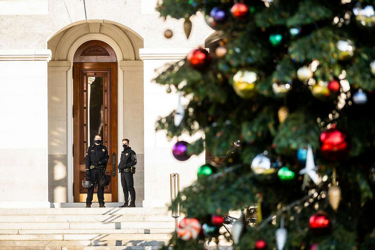 California Highway Parol officers stand watch outside the California State Capitol in Sacramento following a protest in support of President Trump on Jan. 6.