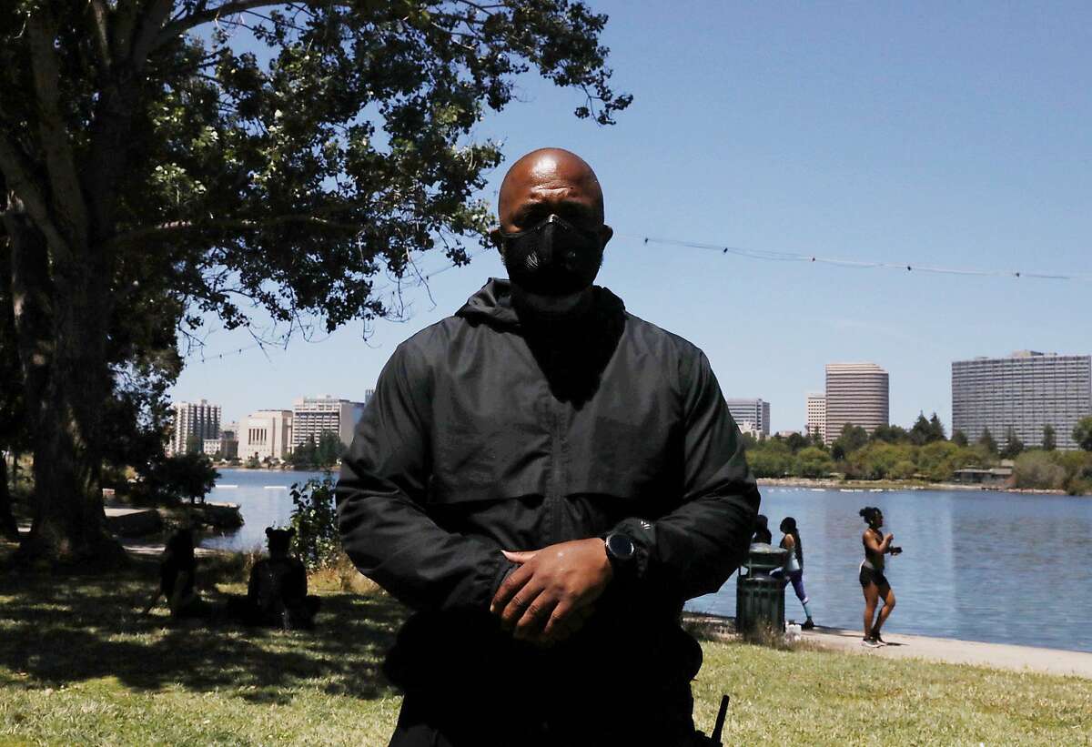 Tur-Ha Ak, founder of Oakland’s Community Ready Corp, poses for a portrait near a tree where a fake body effigy was found hanging near Lakeshore and Wayne avenues along Lake Merritt in Oakland, Calif. Thursday, June 18, 2020. He calls for community members to join their lake patrol efforts and is unsure how this incident got past last night’s patrols.